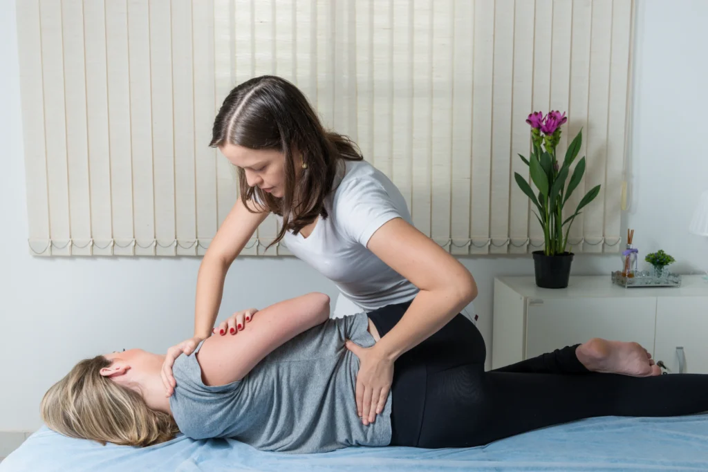 Chiropractor giving care to patient in a MCR clinic.