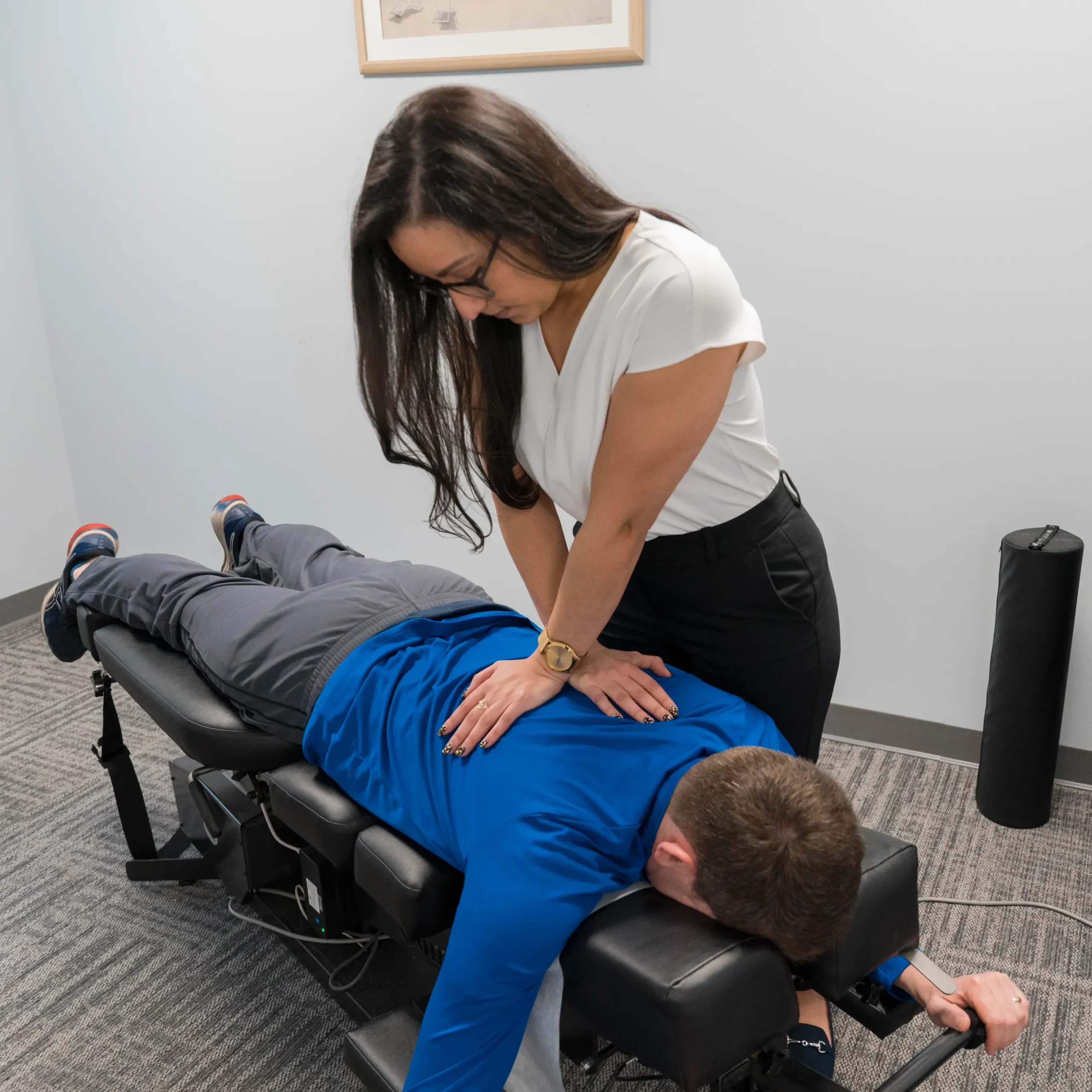 Chiropractor giving patient care at a MCR Clinic Spring 2025.