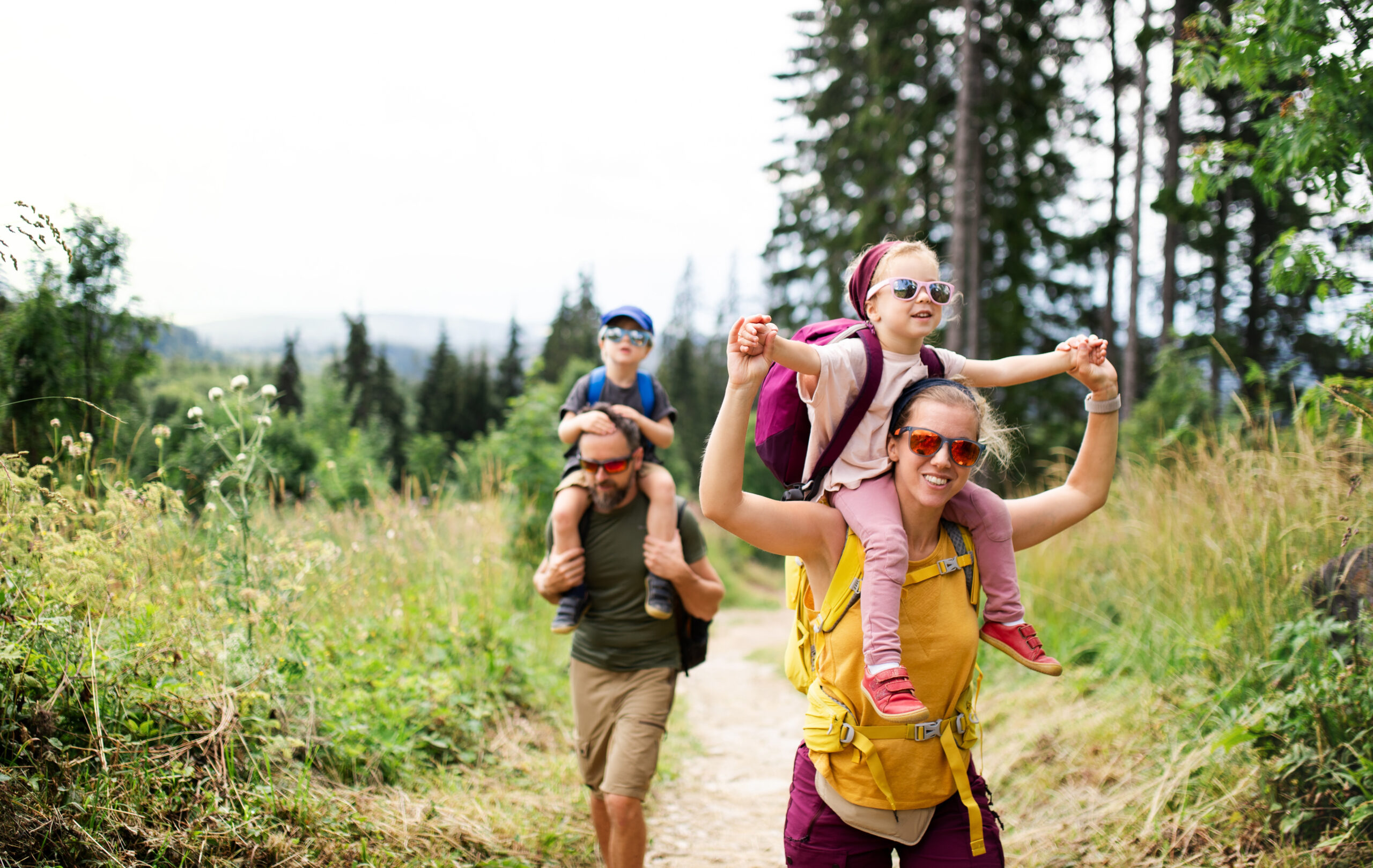 family with small children hiking outdoors